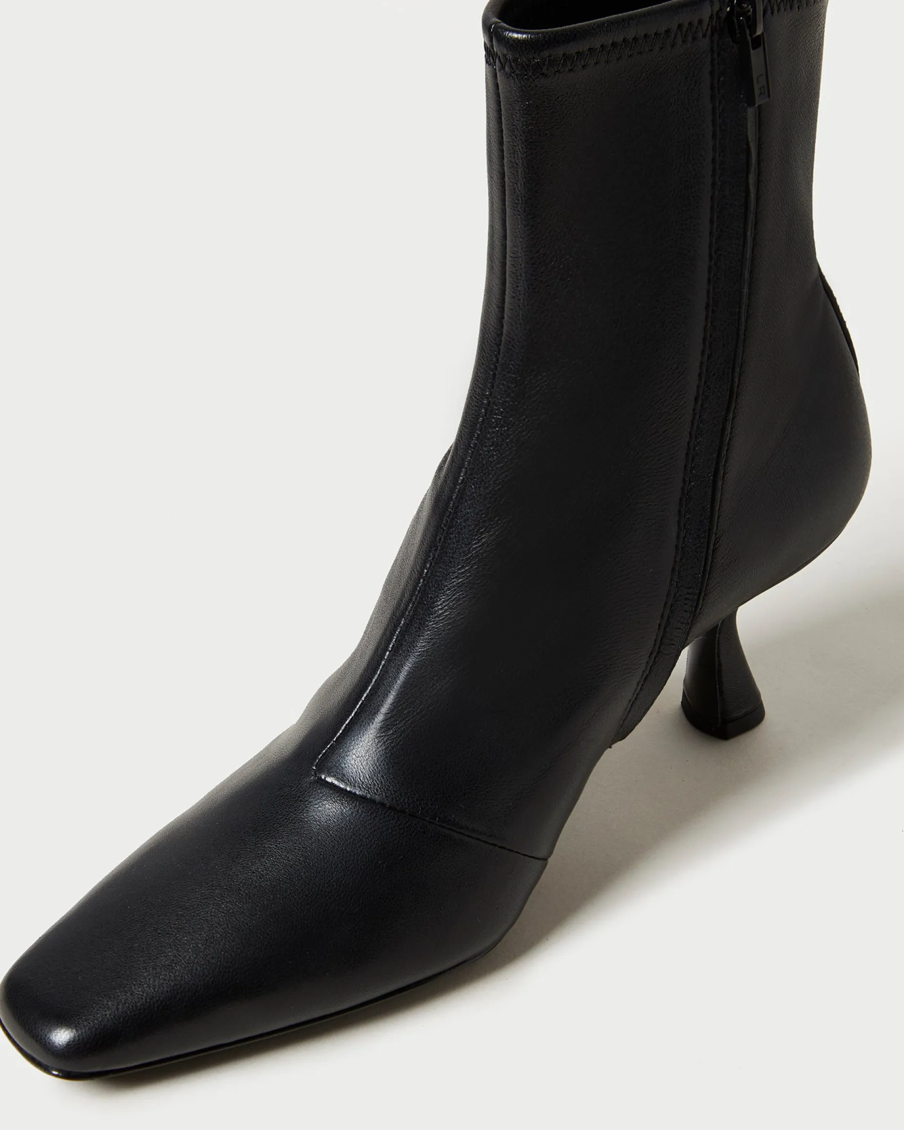 Thandy Black Curved Heel Bootie