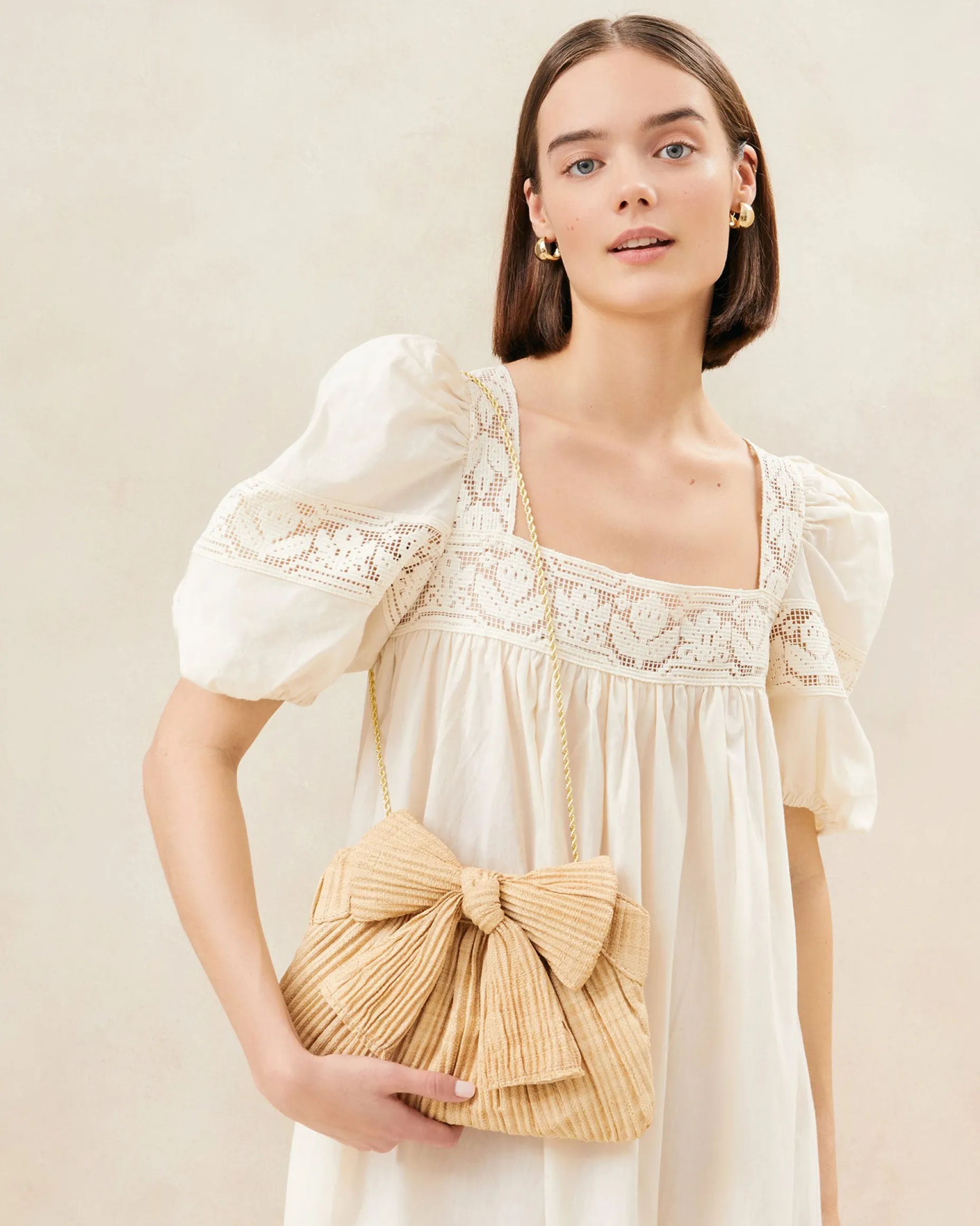 Rayne Champagne Bow Clutch